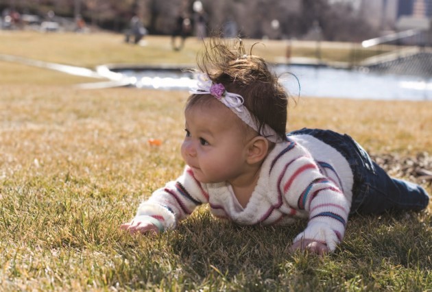 Baby on their stomach outside