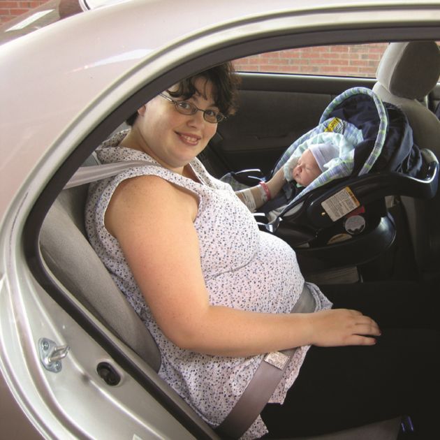 Mom and baby buckled into the car