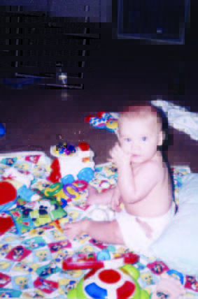 Baby playing with toys on a mat