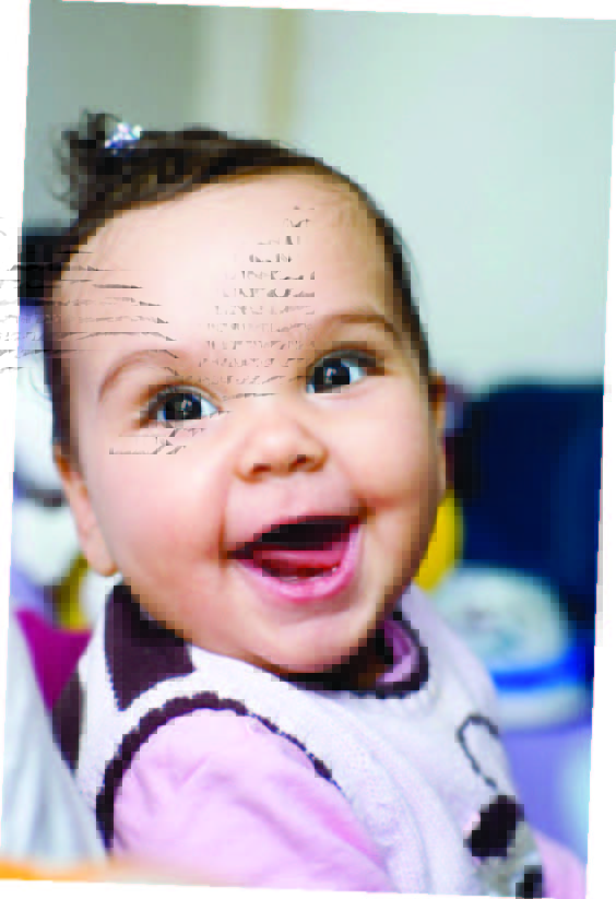 Baby smiling at the camera