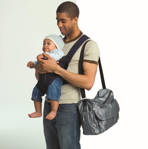 Dad with baby in a carrier on his chest