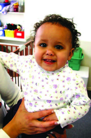 Baby showing their first teeth