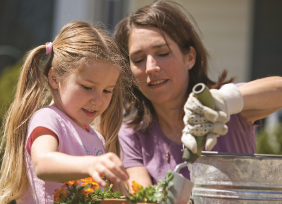 Mom and daughter gardening