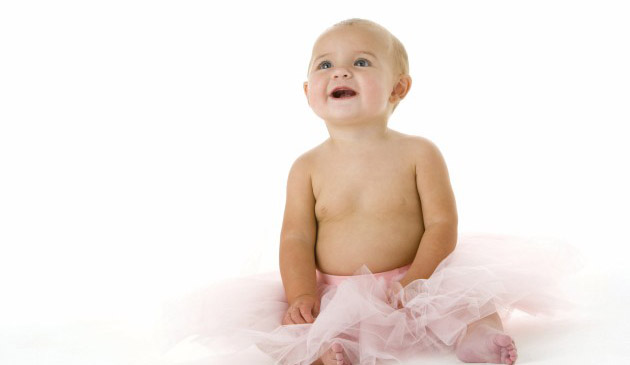 Baby smiling in a tutu