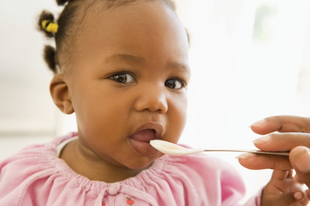 Baby eating from a spoon