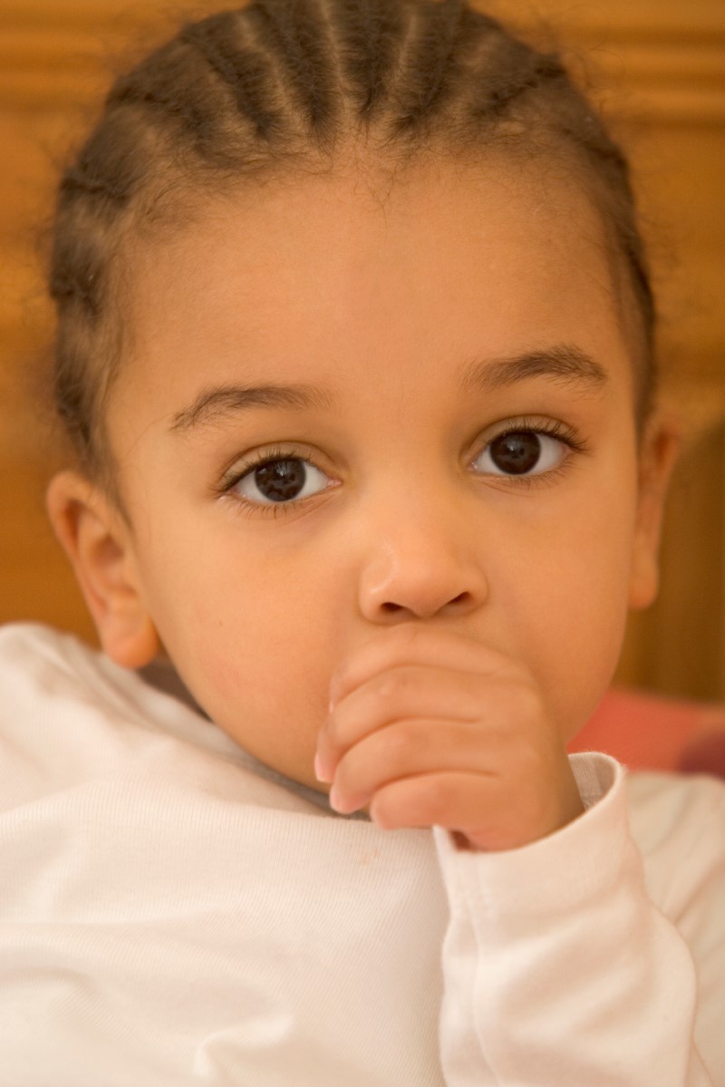 Child sucking their thumb