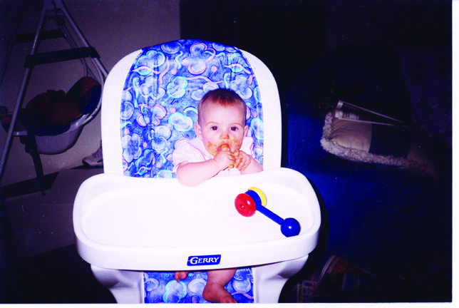 Baby eating in their high chair